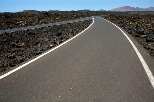 Black volcanic soil and road detail in Lanzarote Canary Island
