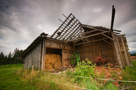 dilapidated barn under dramatic skies in the Allgäu
