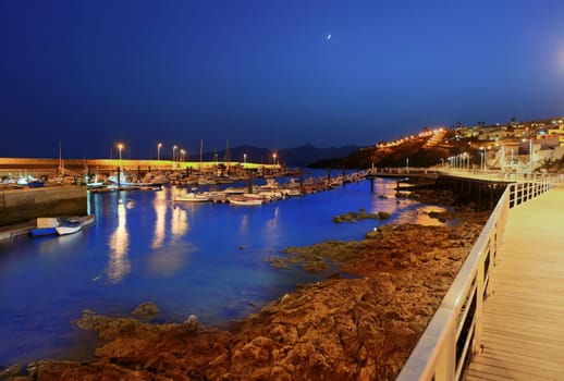 Lanzarote Puerto del Carmen harbour night view in Canary Islands