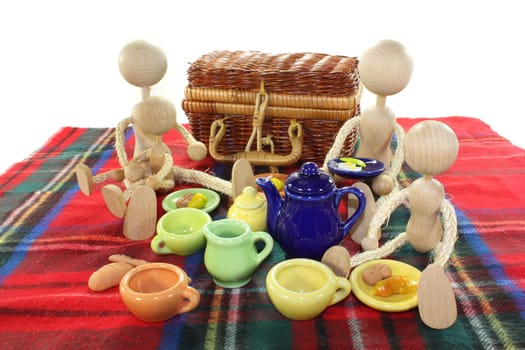 A small family on a blanket having a picnic