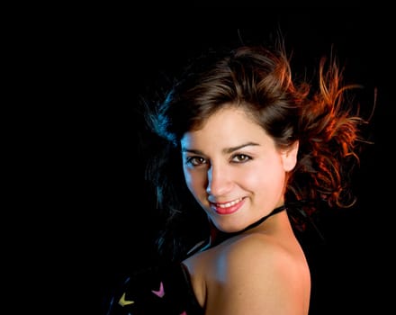 Portrait of a beautiful young and attractive woman on a black background
