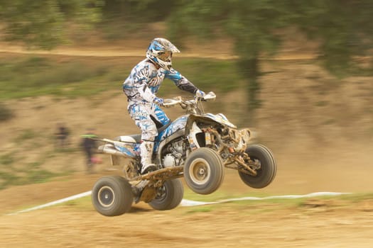 MOHELNICE,  CZECH REPUBLIC - SEPTEMBER 08: Panning shot of quad riderjumps in the "International Championship of the Czech Republic 2012"" on September 08, 2012 in MOHELNICE, Czech Republic."