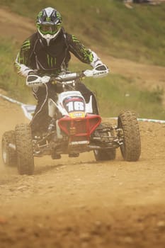 MOHELNICE,  CZECH REPUBLIC - SEPTEMBER 08: Unidentified racer rides a quad motorbike in the "International Championship of the Czech Republic 2012"" on September 08, 2012 in MOHELNICE, Czech Republic."