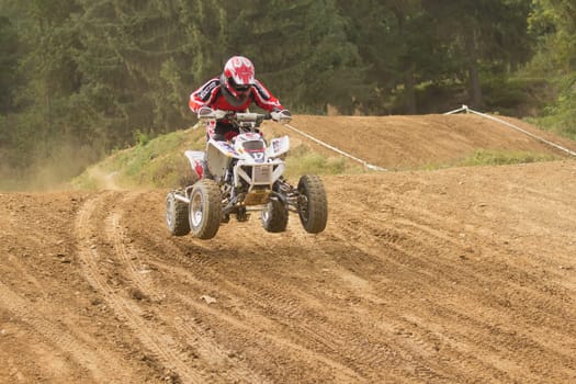 MOHELNICE,  CZECH REPUBLIC - SEPTEMBER 08: Unidentified racer rides a quad motorbike in the "International Championship of the Czech Republic 2012"" on September 08, 2012 in MOHELNICE, Czech Republic."