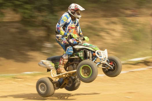 MOHELNICE,  CZECH REPUBLIC - SEPTEMBER 08: Unidentified racer jumps a quad motorbike in the "International Championship of the Czech Republic 2012"" on September 08, 2012 in MOHELNICE, Czech Republic."
