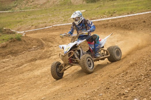 MOHELNICE,  CZECH REPUBLIC - SEPTEMBER 08: Unidentified young rider a quad motorbike in the "International Championship of the Czech Republic 2012"" on September 08, 2012 in MOHELNICE, Czech Republic."