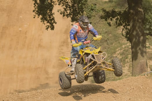 MOHELNICE,  CZECH REPUBLIC - SEPTEMBER 08: Unidentified racer rides a quad motorbike in the "International Championship of the Czech Republic 2012"" on September 08, 2012 in MOHELNICE, Czech Republic."