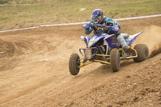 MOHELNICE,  CZECH REPUBLIC - SEPTEMBER 08: Unidentified racer rides a blue quad motorbike in the "International Championship of the Czech Republic 2012"" on September 08, 2012 in MOHELNICE, Czech Republic."