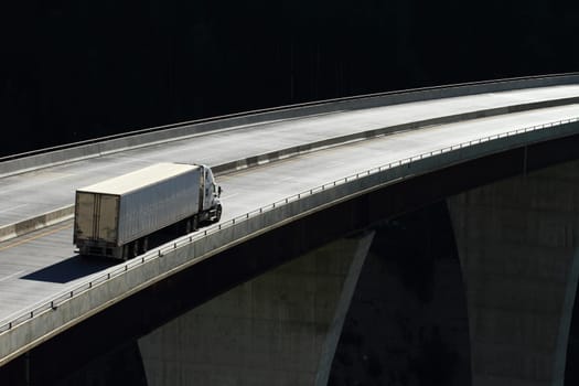 Semi trailer truck crossing a high level bridge in British Columbia, Canada
