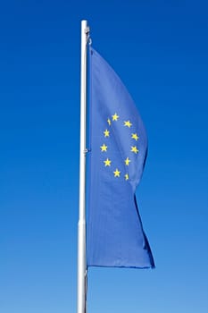 european flag waving on a pole