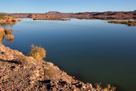 El-Mansour Eddabbi dam with mountains, Ouarzazate, Morocco.