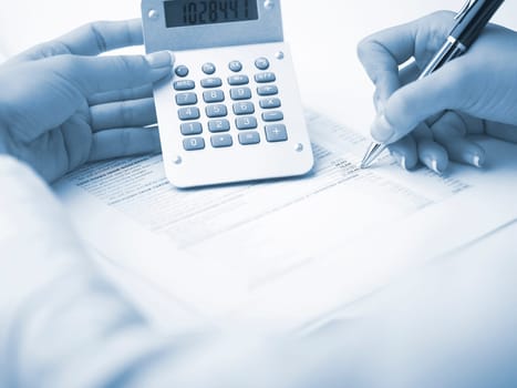 Market Analyze - pen and calculator on papers