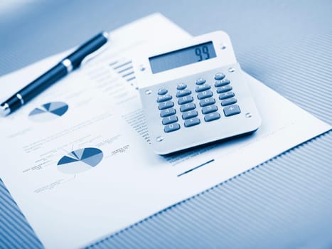 Market Analyze - pen and calculator on papers