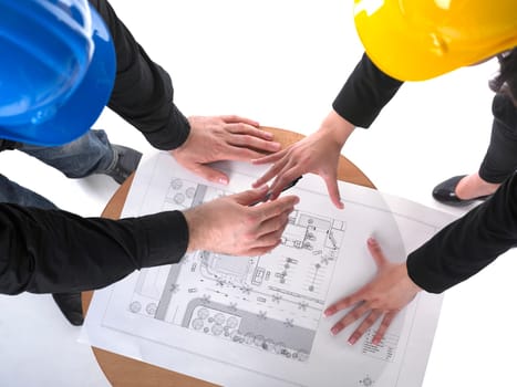 Two architects with hard hats and plan on meeting in office