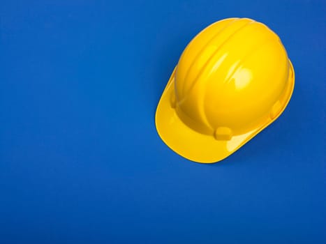 Yellow Hardhat hard hat Helmet on Blue
