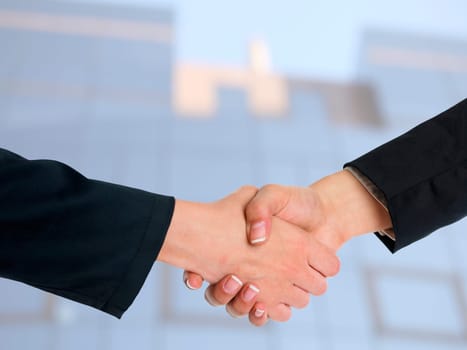 Handshake Handshaking and blured building in background