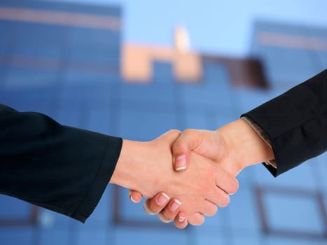Handshake Handshaking and blured building in background