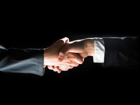 Handshake Handshaking light and dark