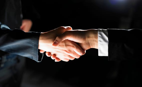 Handshake Handshaking light and dark