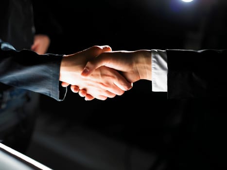 Handshake Handshaking light and dark
