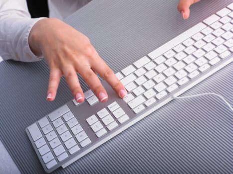 Business Secretary Typing on Computer Keyboard