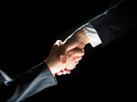 Handshake Handshaking light and dark