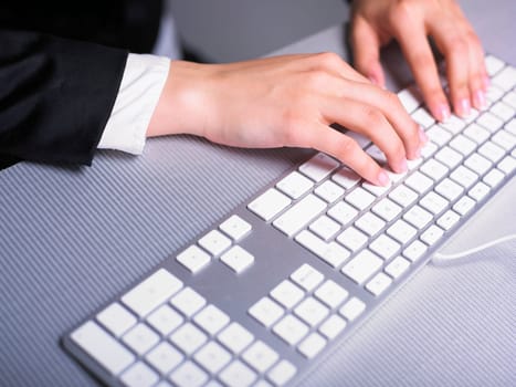 Business Secretary Typing on Computer Keyboard