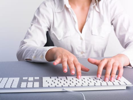 Business Secretary Typing on Computer Keyboard
