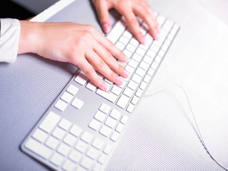 Business Secretary Typing on Computer Keyboard