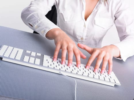 Business Secretary Typing on Computer Keyboard