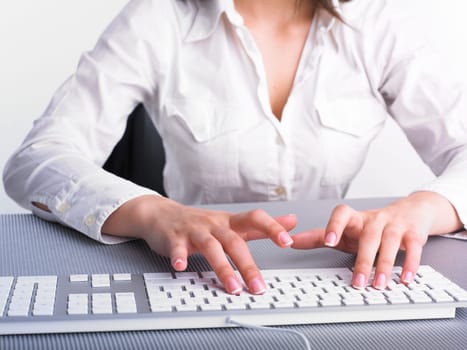 Business Secretary Typing on Computer Keyboard