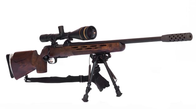 Sniper Rifle with scope atached on a tripod isolated on white background