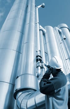 gas-worker, engineer, with large gas pipes in background, metallic blue toning idea
