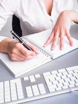 Office Assistant in white writing Schedule