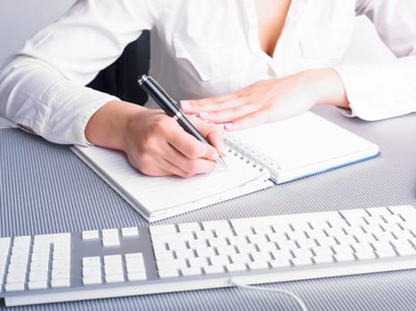 Office Assistant in white writing Schedule