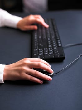 Business Secretary Typing on Computer Keyboard