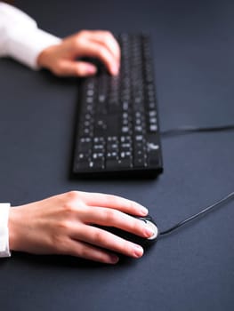 Business Secretary Typing on Computer Keyboard