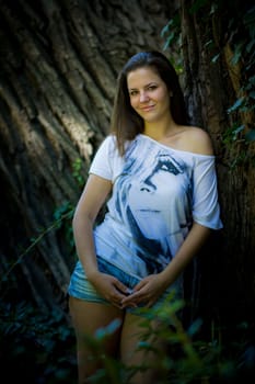 Young woman in the forest on a sunny day