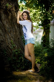 Young woman in the forest on a sunny day