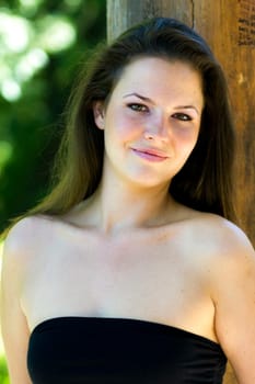 Beautiful young woman in the park on a sunny day