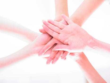 Business team join hands on white background