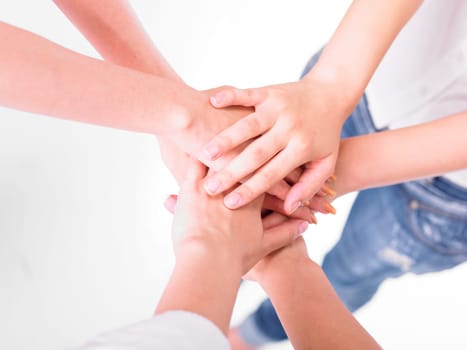 Business team join hands on white background