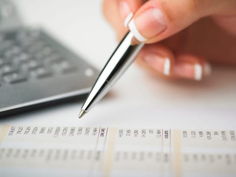 Market Analyze - pen and calculator on papers