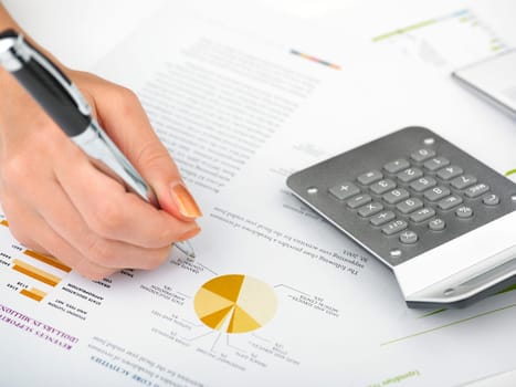 Market Analyze - pen and calculator on papers
