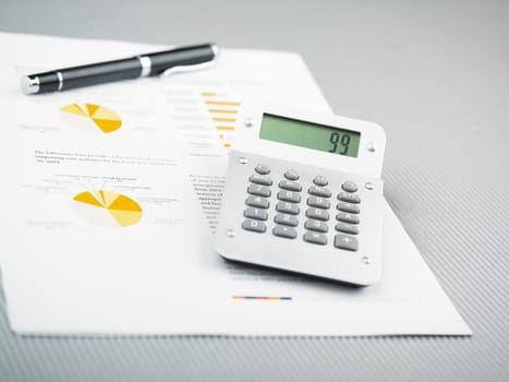 Market Analyze - pen and calculator on papers