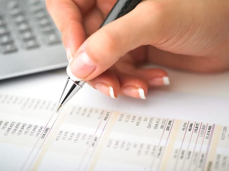 Market Analyze - pen and calculator on papers