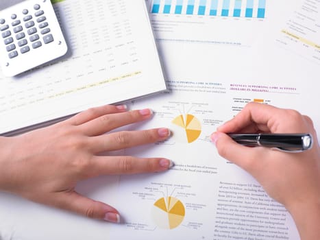 Analyzing Business Data - pen and numbers on paper