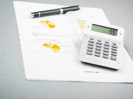 Market Analyze - pen and calculator on papers