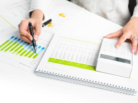 Market Analyze - pen and calculator on papers