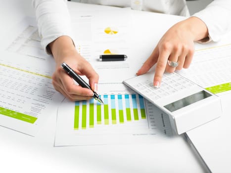 Market Analyze - pen and calculator on papers